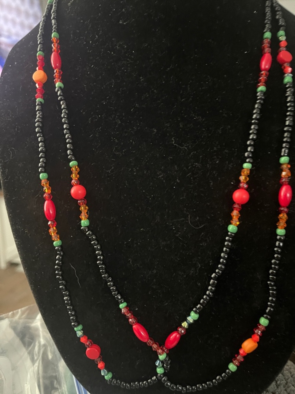 Handcrafted Black Beaded Necklace with Red & Green Accents